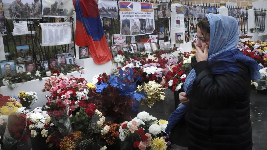 A woman grieves for victims of the military conflict in the self-proclaimed Nagorno-Karabakh Republic in front of the Armenian embassy in Moscow. Photograph: Maxim Shipenkov