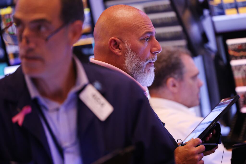 Traders work on the floor of the New York Stock Exchange: sharp share price falls reflect fears of a US recession which could speed American interest rate cuts.
(Photo by Michael M. Santiago/Getty Images)