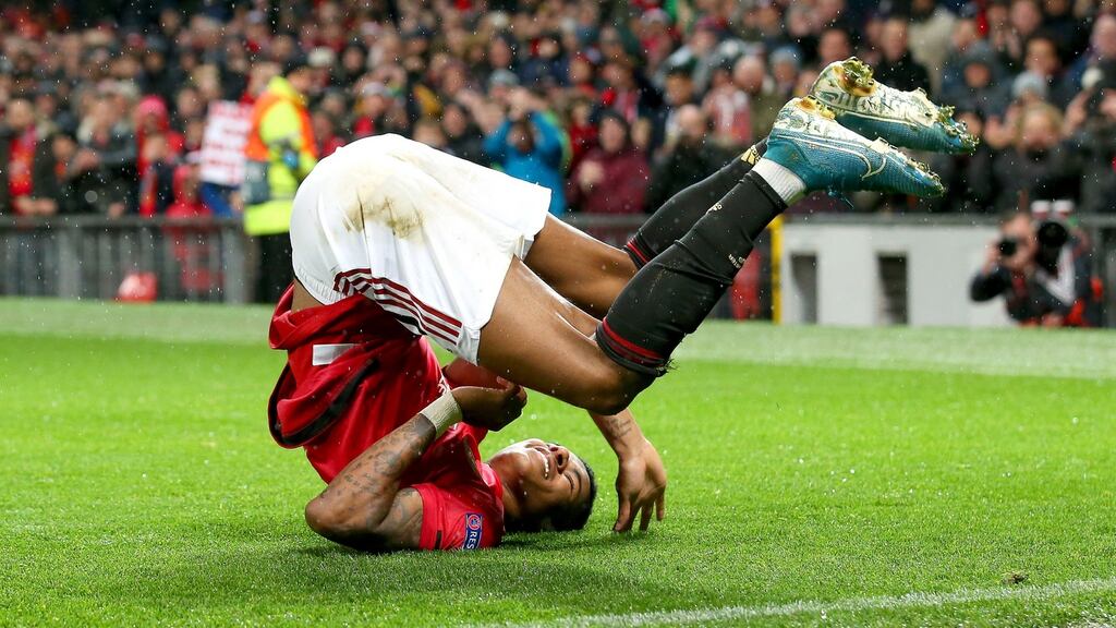 Marcus Rashford celebrates scoring Manchester United’s third against Partizan Belgrade. Photograph: Alex Livesey/Getty