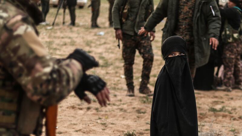 A veiled child evacuated from Isis’s embattled holdout of Baghouz at a screening area, in the eastern Syrian province of Deir Ezzor. Photograph: Getty Images