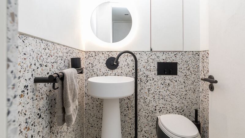 After: The bathrooms have been tiled with Italian terazzo