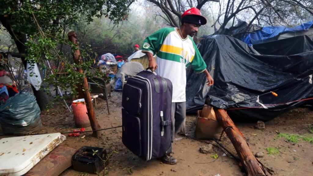 Terrell Brown leaves “The Jungle” in San Jose, the largest homeless encampment in the US until it was cleared out by the authorities on Thursday. Photograph: Jim Wilson/The New York Times