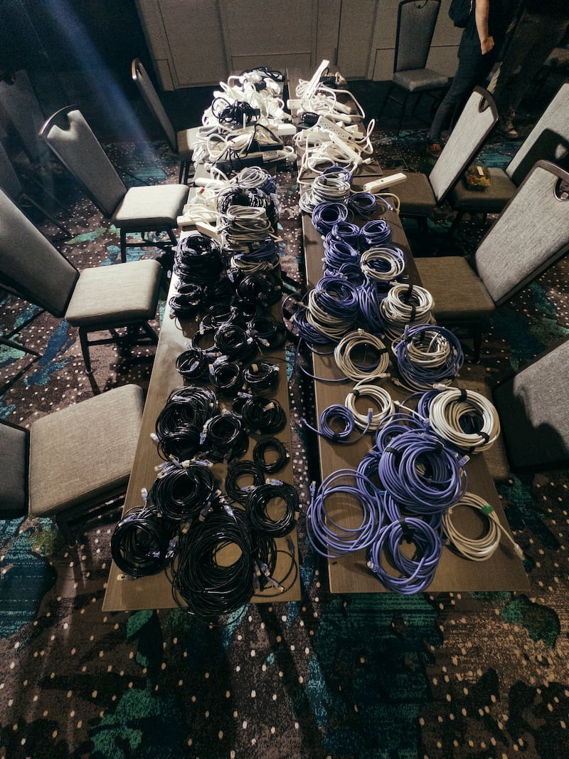 A table in the AI Village at the annual Defcon conference in Las Vegas. Photograph: Mikayla Whitmore/The New York Times