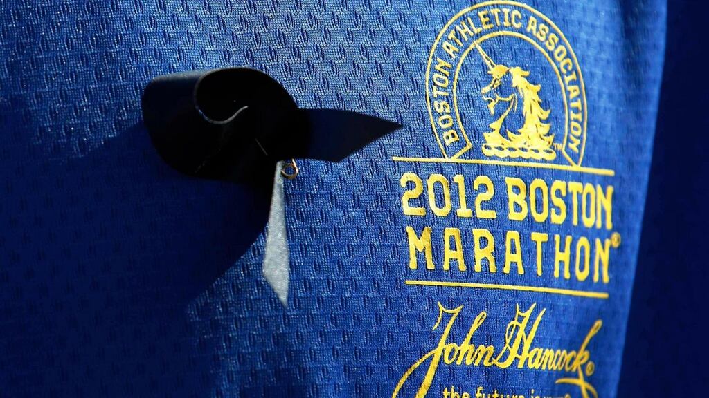Runner Jason Darnall of Kentucky, who ran the Boston Marathon in 2012 but chose to run the London Marathon this year, wears a black ribbon at the start of the London Marathon. Photograph: Luke MacGregor/Reuters