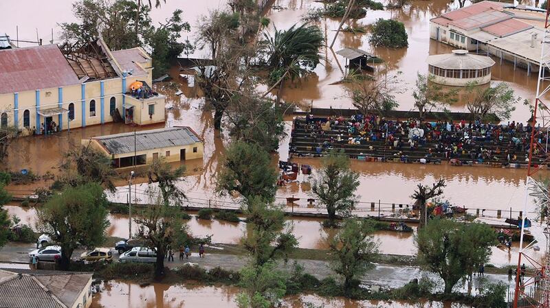 Residents gather stranded on the stands of a stadium in a flooded area of Buzi in Mozambique after cyclone Idai. Photograph: Adrien Barbier/AFP/Getty Images