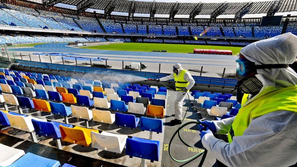 Operators of ‘Napoli Servizi’ sanitise the San Paolo stadium in Naples to prevent the dangers of the coronavirus. Photograph: EPA