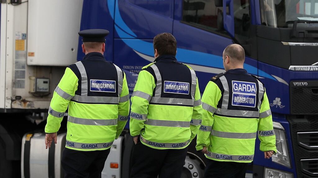 Garda immigration officers at Dublin Port which is thought to have been used by the lorry which subsequently collected the trailer in which 39 people were found dead. Photograph: PA