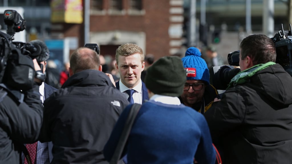 Ireland and Ulster rugby player Stuart Olding (centre) leaving Belfast Crown Court. Photograph: Brian Lawless/PA