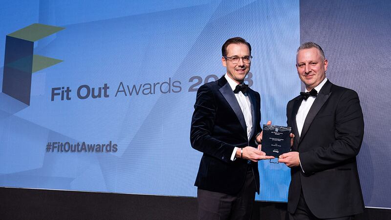 Tony Taylor, chief executive of Etag Fixings Ltd, presents the fit out contractor of the year award to Richard Hemming, Structure Tone