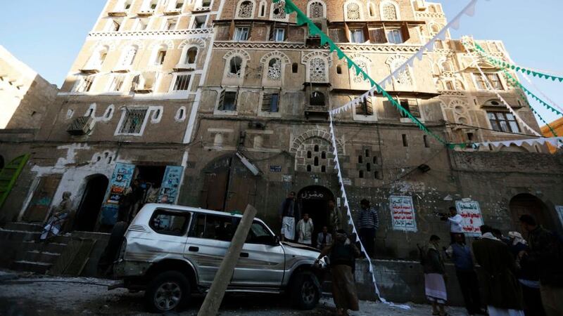 People gather at the scene of a bomb blast in Sanaa, which officials say killed at least one person. Photograph: Reuters/Khaled Abdullah