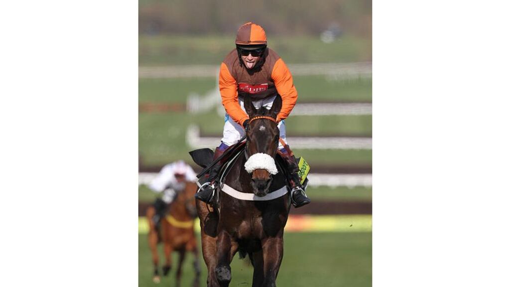 Jockey Sam Waley-Cohen celebrates winning the totesport Cheltenham Gold Cup on Long Run during the Gold Cup Day at Cheltenham Racecourse. - (Photograph: David Davies/PA Wire).