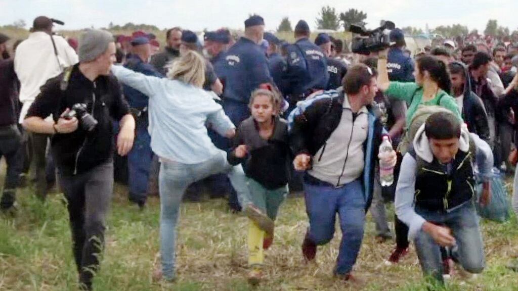 A Hungarian TV camerawoman kicks a migrant child as she runs through a police line in southern Hungary. The camerawoman has been sentenced. File photograph: Index.hu/AFP/Getty Images