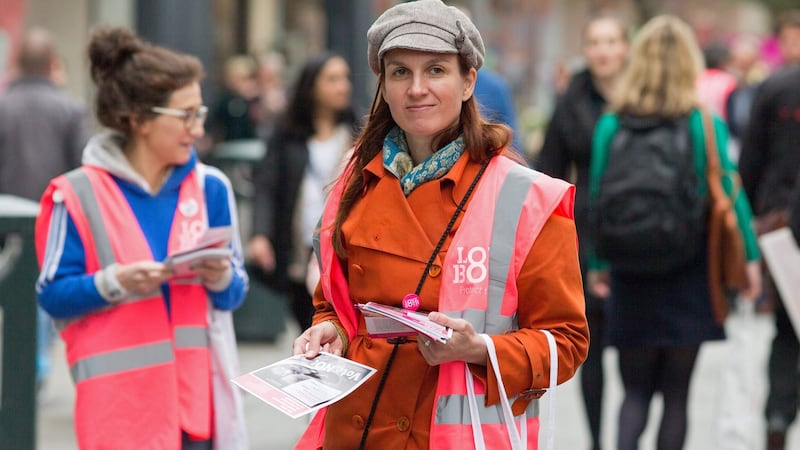 A campaigner with the Love Both anti-abortion campaign canvasses members of the public on Thursday, a day ahead of the referendum on the Eighth Amendment. Photograph: Barry Cronin/AFP/Getty Images