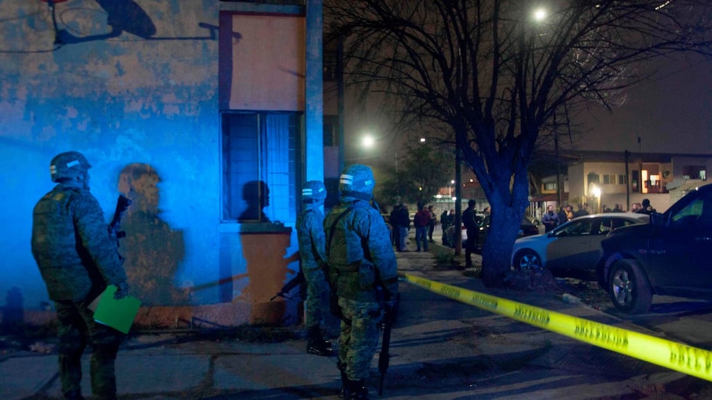 Soldiers patrol the area where nine people were killed in a house while watching a soccer game on TV in Monterrey, Mexico, early today. Photograph: Julio Cesar Aguilar/AFP/Getty Images