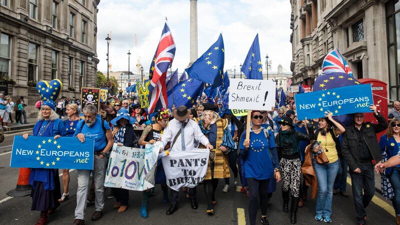 Protesters wave flags and hold placards as thousands march to Parliament Square in support of the European Union in London. Photograph: Jack Taylor/Getty Images