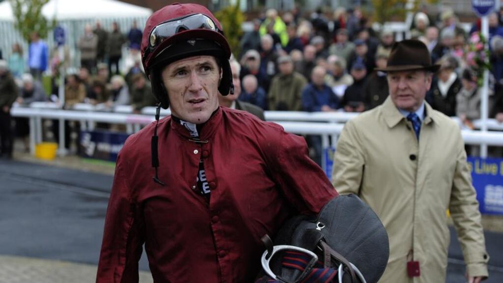 Tony McCoy shows his discomfort after riding his 150th winner at  Wetherby on Wednesday. A shoulder injury means he will miss the two-day meeting at Cheltenham this weekend. Photograph: John Giles/PA