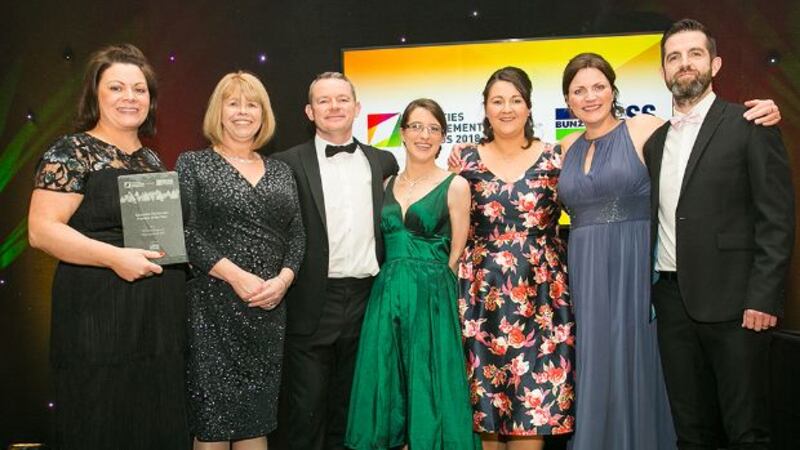 Liam Smith, Sales Director, Essity Ireland, presents the Specialist FM Service Provider of the Year award to Winters Property Management DAC Team