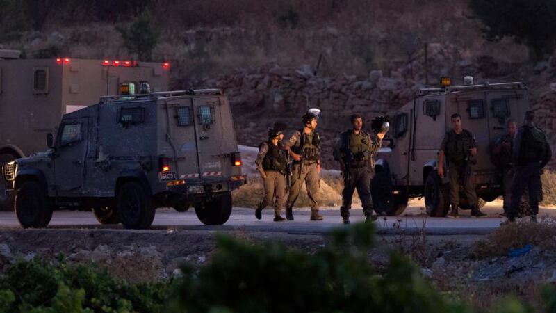 Israeli army and police by armoured vehicles in the West Bank village of Halhoul, north of Hebron, where reportedly the bodies of the three Israelis teenagers, missing and presumed kidnapped since June 12th, were discovered in a cave. Photograph: Jim Hollander/EPA
