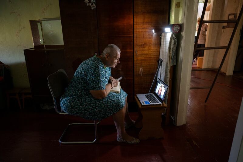 Svitlana Tsoy (65), during a remote checkup with a student doctor at Stanford University in California, at a mobile clinic in Siversk, Donetsk in September. Photograph: Lynsey Addario/New York Times