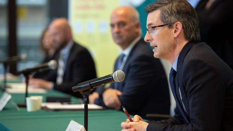 Dr Ronan Glynn sits to Dr Holohan’s left during the regular National Public Health Emergency Team briefings at the Department of Health. Photograph: Collins