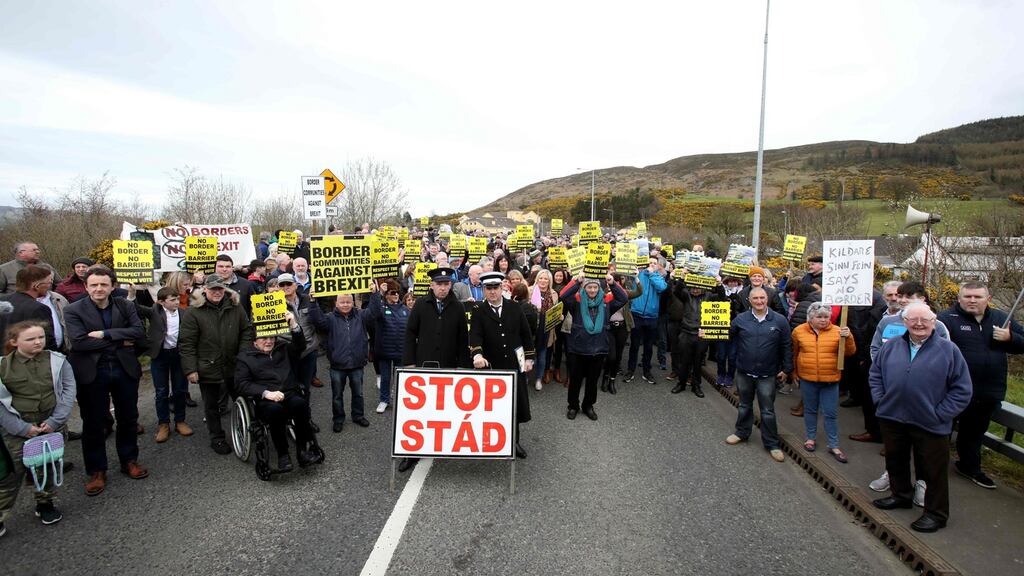 Protesters against a hard Border hold placards at the Carrickcarnan border between Newry and Dundalk. Photograph: Paul Faith/AFP/Getty Images