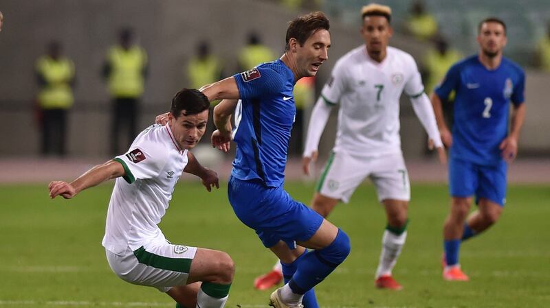 Josh Cullen races onto a loose ball at the Olympic stadium in Baku. Photograph: AP