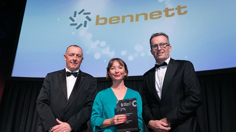 Collette Burns, Awards Judge, presents the International Project of the Year award to Ciaran Gormley & Paul Bruton, Bennett Construction.