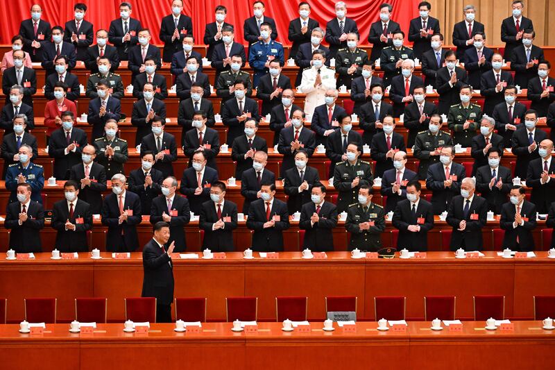 China's president Xi Jinping waves as he arrives for the opening session of the 20th Chinese Communist Party's Congress at the Great Hall of the People in Beijing on Sunday. Photograph: Noel Celis/AFP/Getty