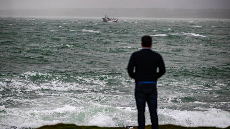 Watching the search effort for a missing fisherman off Hook Head, Co Wexford on Sunday. Photograph: Patrick Browne