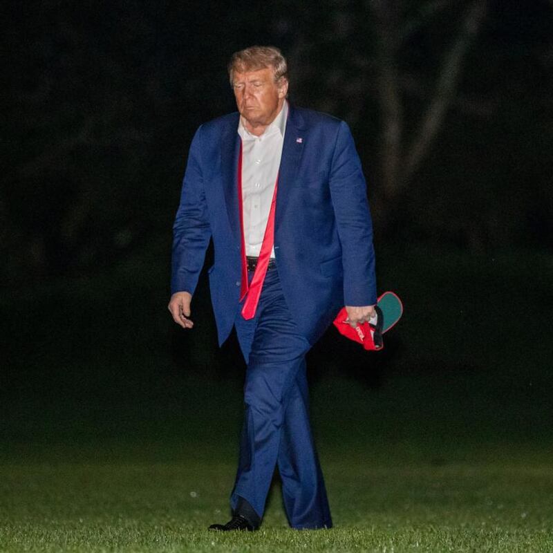 A gloomy Donald Trump came back from Oklahoma with his tie undone. Photograph: Patrick Semansky/AP Photo