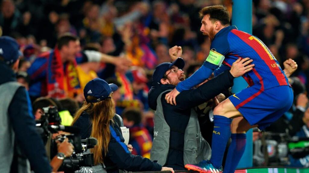 Barcelona’s Lionel Messi celebrates with fans after helping his side overturn a 4-0 loss to knock PSG out of the Champions League. Photo: Lluis Gene/Getty Images