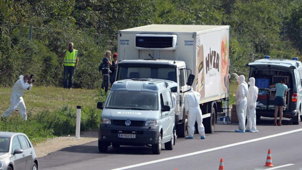 Forensic experts investigate a truck in which 50 refugees were found dead on the road between Parndorf and Neusiedl in Austria. The driver has disappeared, according to reports. Photograph: Roland Schlager/EPA