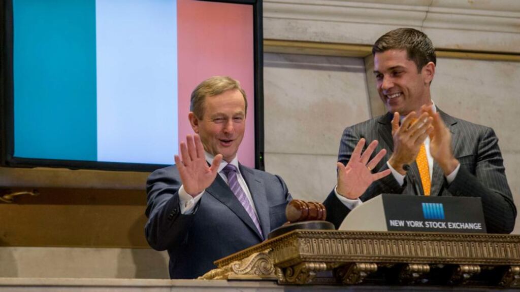 Taoiseach Enda Kenny rings the opening bell at the New York Stock Exchange yesterday, beside NYSE president Tom Farley. Photograph: Brendan McDermid/Reuters