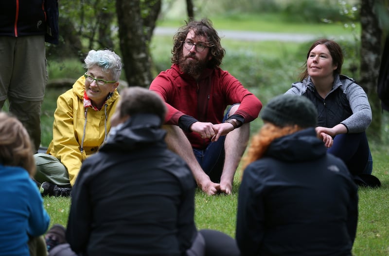Forest bathing training: Ciaran Thorton (centre) taking part in the course in Glendalough forest, Co Wicklow, led by Shirley Gleeson (right). Photograph: Crispin Rodwell