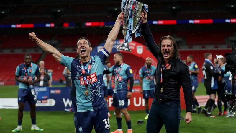 Wycombe Wanderers manager Gareth Ainsworth and captain Matthew Bloomfield celebrate after the League One playoff final against Oxford United at Wembley Stadium. Photograph: Catherine Ivill/Getty Images