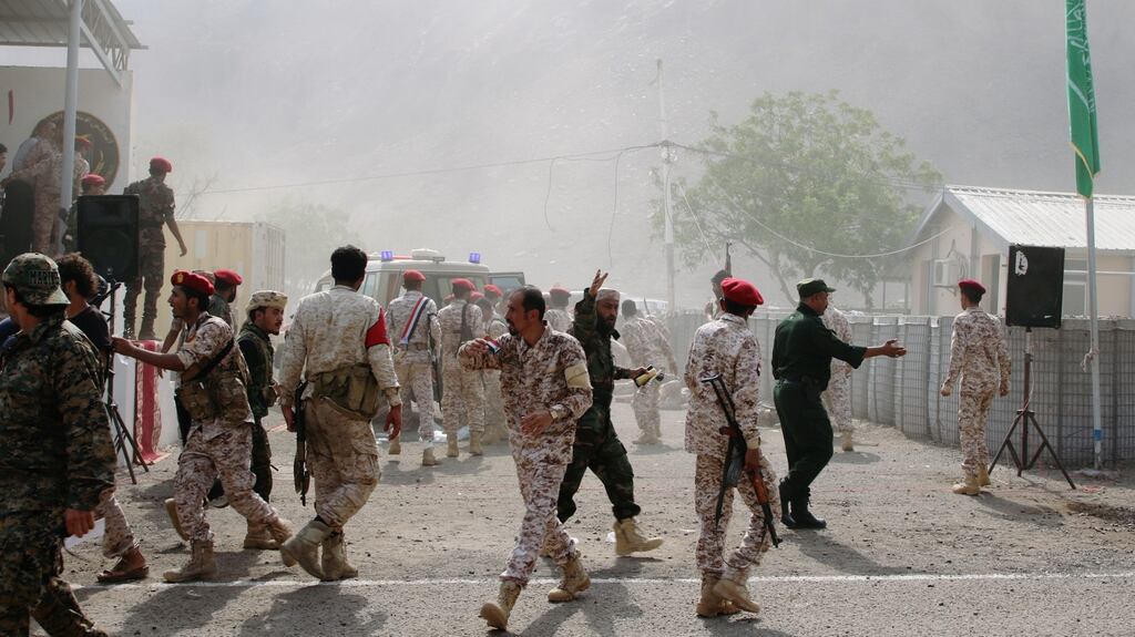 Soldiers rush to help the injured following a missile attack on a military parade during a graduation ceremony for newly recruited troopers in Aden. Photograph: Fawaz Salman/Reuters