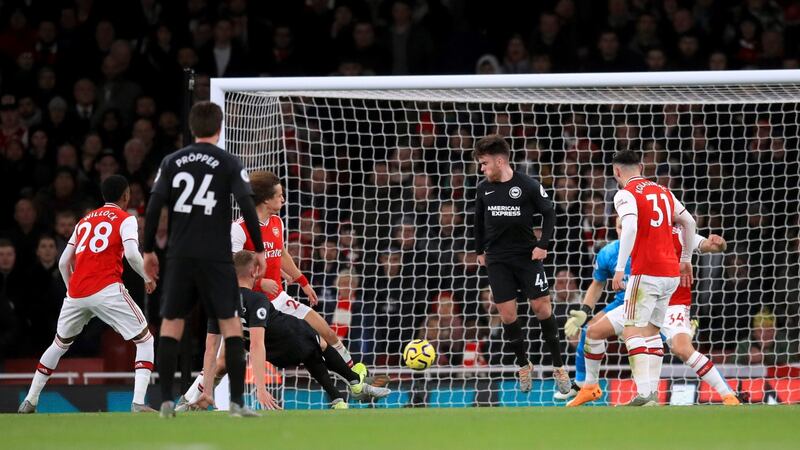 Adam Webster opens the scoring for Brighton at the Emirates. Photograph: Adam Davy/PA