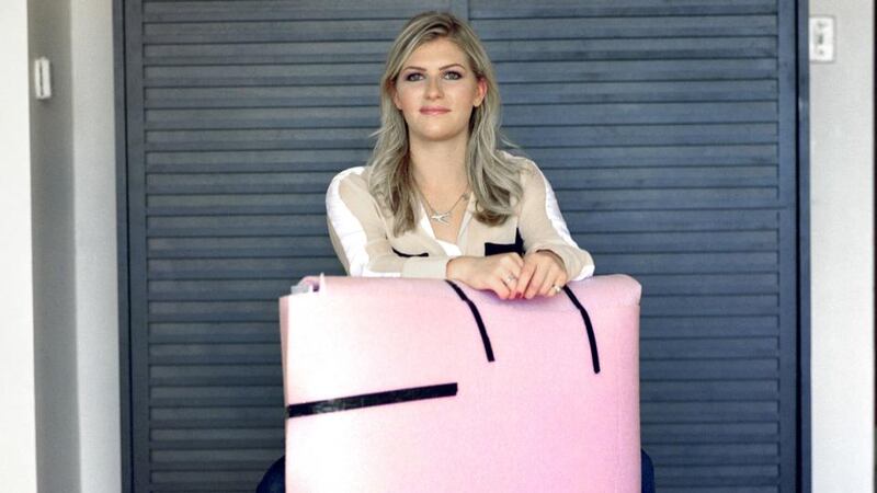 Meredith Perry with a covered prototype of her uBeam wireless charger. Photograph: Peter DaSilva/The New York Times