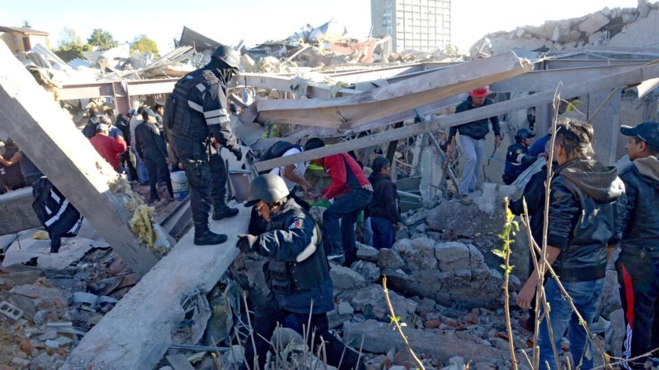 Rescuers work amid the wreckage caused by an explosion in a hospital in Cuajimalpa, Mexico City. Photograph: Getty Images