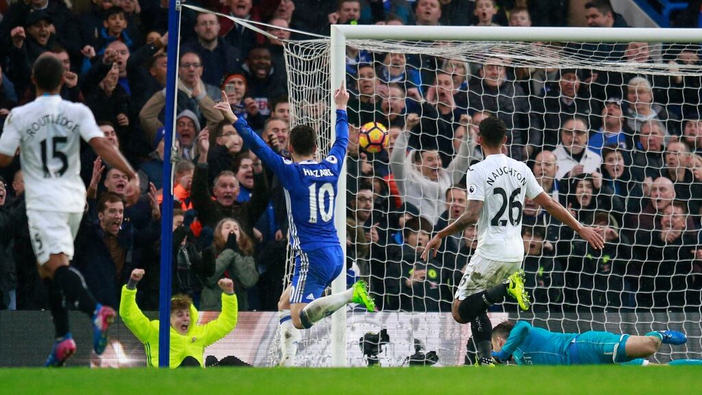 Chelsea’s Eden Hazard celebrates their second goal, scored by Pedro, as Swansea City’s Lukasz Fabianski looks on. Photo: Peter Nicholls/Reuters