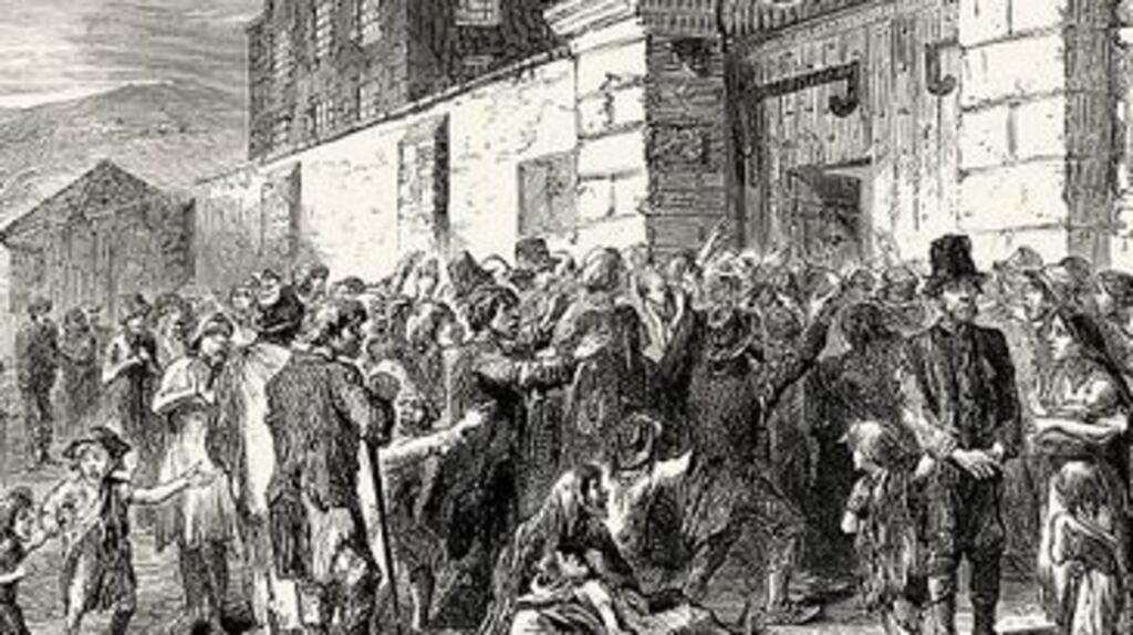 A scene outside a workhouse in Ireland during the Famine. One million people died and more than one million emigrated. Photograph: Getty Images