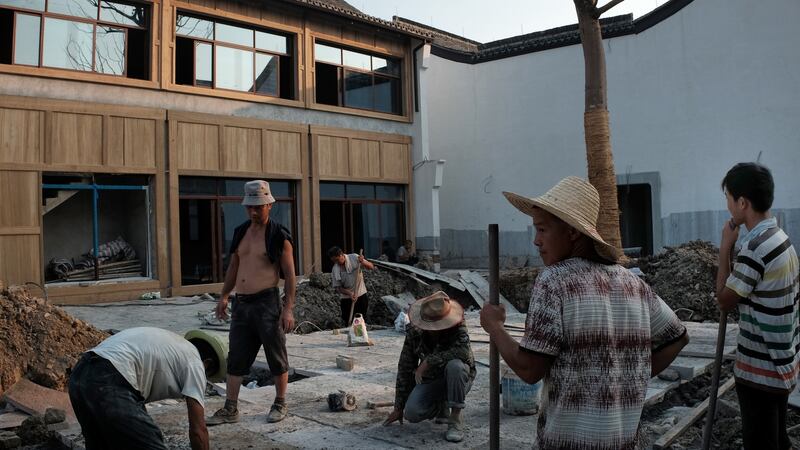 Remodelling houses inside Dream Town in Hangzhou. The government built Dream Town and lavishes resources on hundreds of start-ups there. Photograph: Jes Aznar/The New York Times