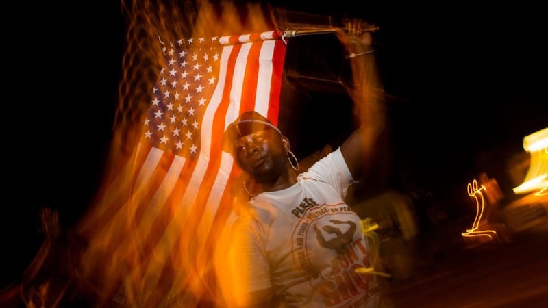A protester in Ferguson, Missouri on Thursday night. Photograph: Eric Thayer/The New York Times