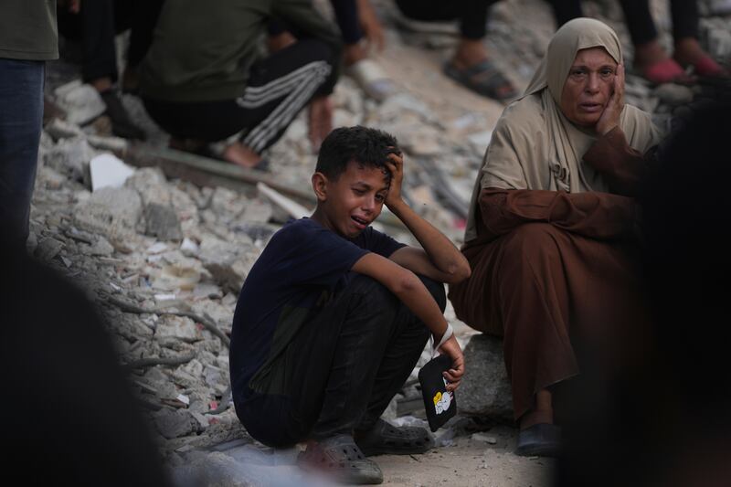 Palestinians mourn during the funeral of people who were killed while trying to reach aid trucks. Photograph: Abdel Kareem Hana/AP
