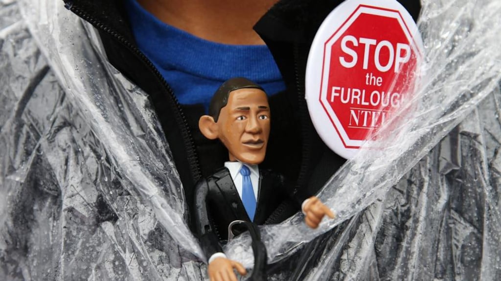 Teri McLain wears a US President Barack Obama figure during a rally to urge Congress to end the government shutdown at the US Capitol in Washington, DC. Photograph: Mark Wilson/Getty Images