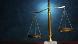 Convicted killer who carried out armed raids while serving suspended sentence jailed