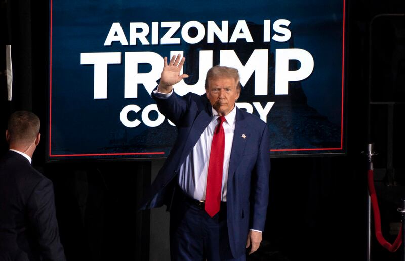 Donald Trump leaves after a campaign event at the Tucson Music Hall in Tucson, Arizona, on Thursday, where the Whitehouse hopeful launched a scathing attack on his opponent.  Photograph: Rebecca Noble/Getty Images