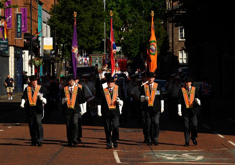 Marchers in Belfast take part in the traditional Twelfth commemorations. Photograph: Mark Marlow/PA