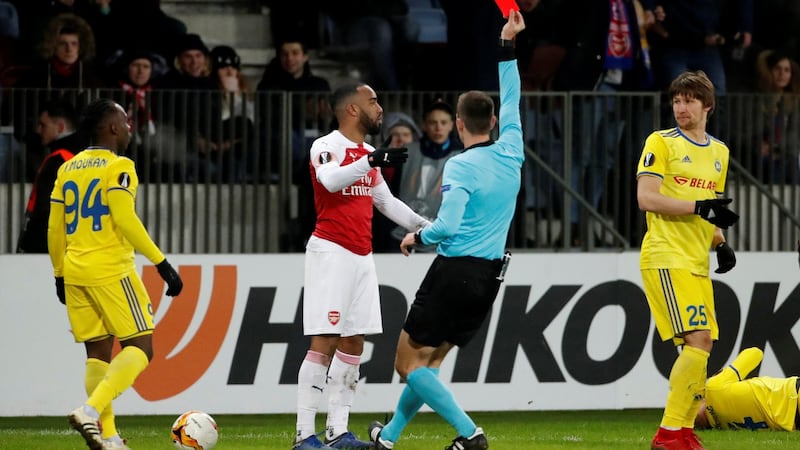 Alexandre Lacazette is sent off by referee Srdjan Jovanovic. Photograph: Vasily Fedosenko/Reuters