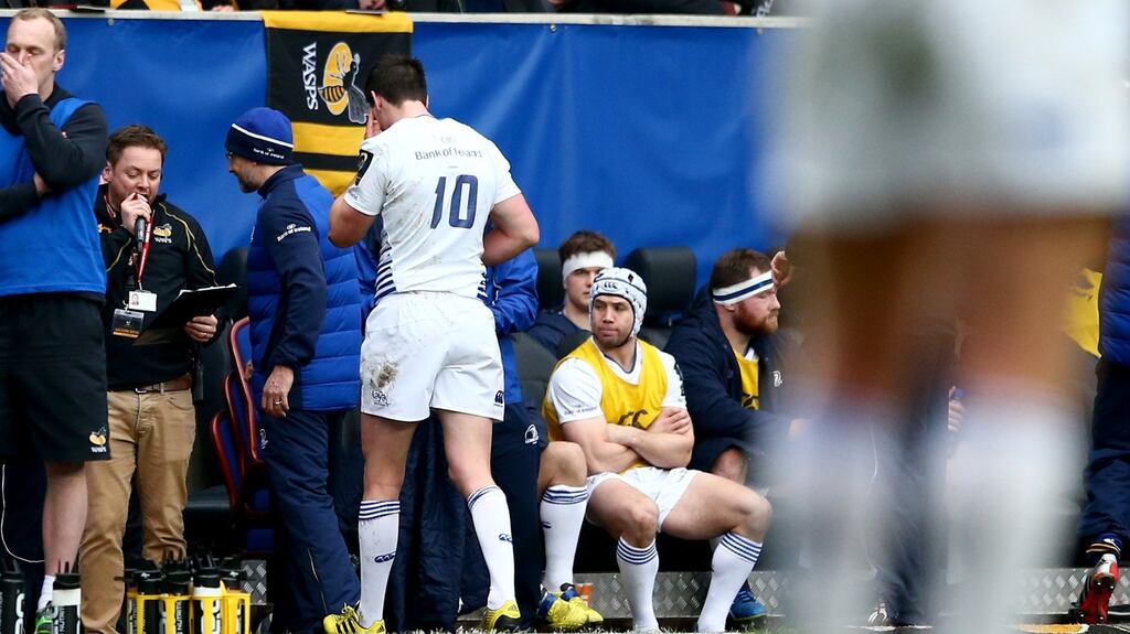 Johnny Sexton leaves the field after suffering a head injury in the match with Wasps: the Leinster and Ireland outhalf suffered four concussions in 2014. Photograph: James Crombie/Inpho